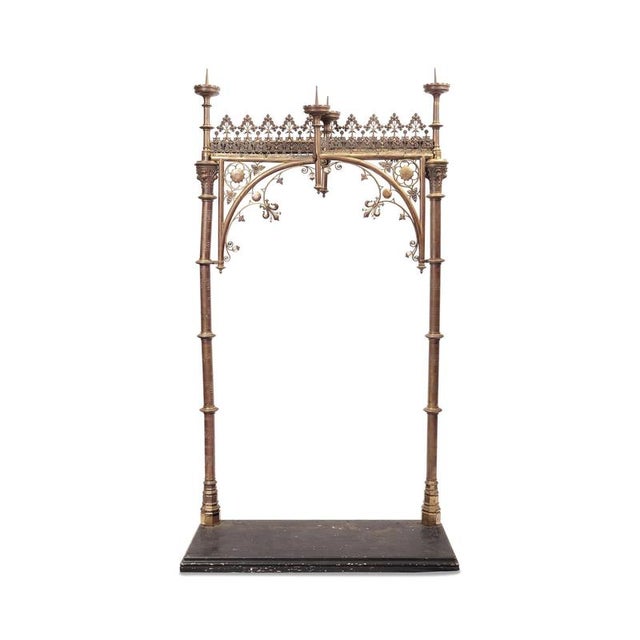 Sacred stand with fixtures for four candles and curtain probably used to conceal saints and later presented Side arms...