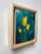 This oil painting features vibrant yellow tulips set against a deep blue background, creating a striking contrast that...