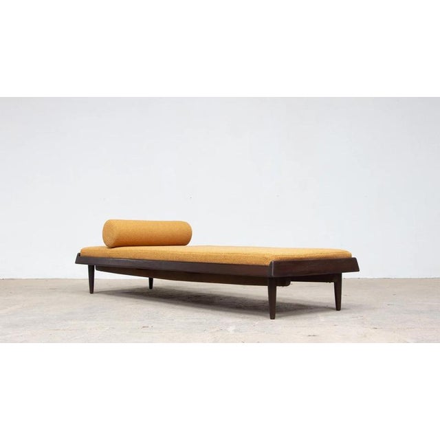 Daybed model 161 by hans olsen for bramin, denmark, 1957. Its low profile and wooden base highlight the piece’s lightness....