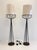 A striking pair of sculptural floor lamps based on an original design by Tony Paul. Constructed from slender black metal...