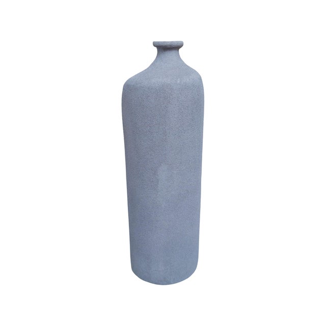 Earthy, sculptural, and effortlessly refined, this vase brings a grounded, organic presence to any space. Crafted with a...