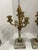 This product is a pair of French neoclassical bronze candelabras from the 19th century. Each candelabra holds four candles...
