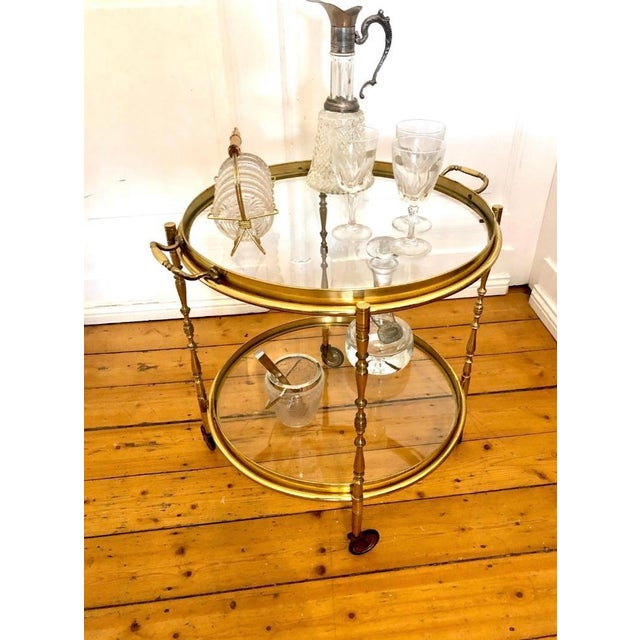 This beautiful, round serving trolley, crafted from solid brass, is an elegant piece of furniture that complements almost...