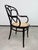 Beautiful and highly collectible antique bentwood armchair, manufactured by the legendary company Thonet (circa...