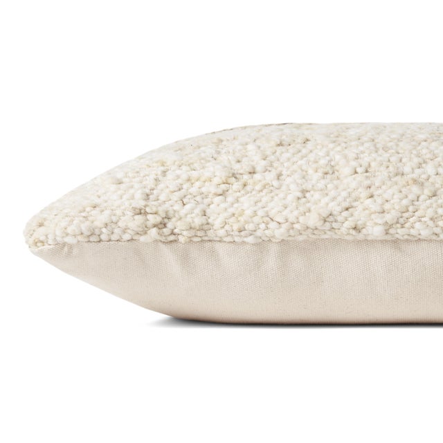 Throw pillows by Amber Lewis x Loloi take inspiration from heirloom textiles and earth-toned palettes to create an...