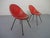 Two French chairs made of red fiberglass from the 1960s.