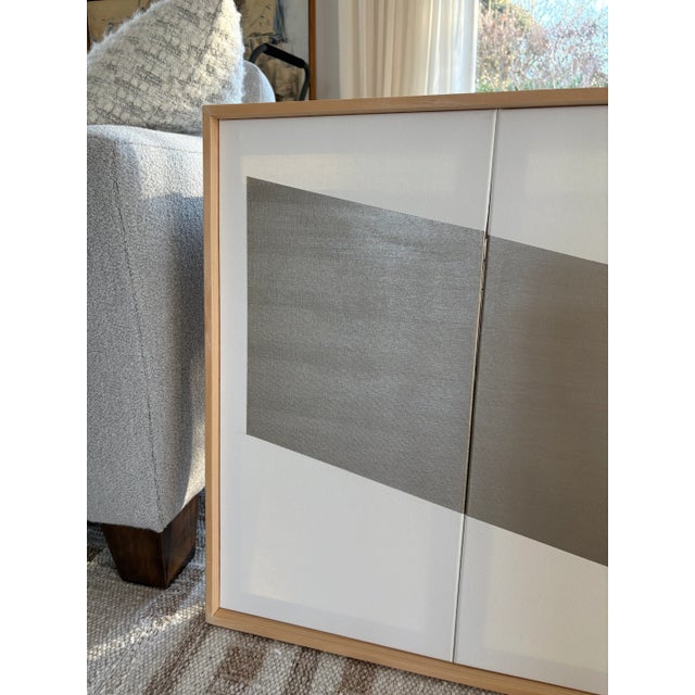 Beautiful hard edge abstract geometric painting rendered in white and pewter acrylics. Comprised of three canvases that...