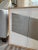 Beautiful hard edge abstract geometric painting rendered in white and pewter acrylics. Comprised of three canvases that...