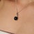 Crafted in 925 sterling silver, this elegant pendant features a mesmerizing 11.55 carat Black Star gemstone in a timeless...
