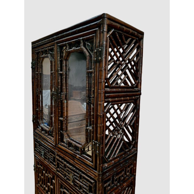 This stunning piece is an authentic antique Chinese bamboo curio/display cabinet. It was crafted in Southern or...
