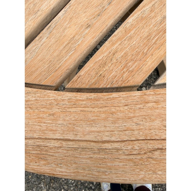 A beautifully crafted solid teak round pedestal dining table by Regal Teak — a premium outdoor furniture brand known for...