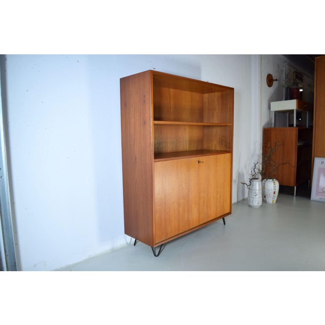 This is an RT piece of furniture from the 1960s by Heinrich Riestenpatt. Heinrich Riestenpatt was a German furniture...
