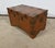 This completely in solid teak trunk is characterized by its many studded straps affirming its character. Assembly with...