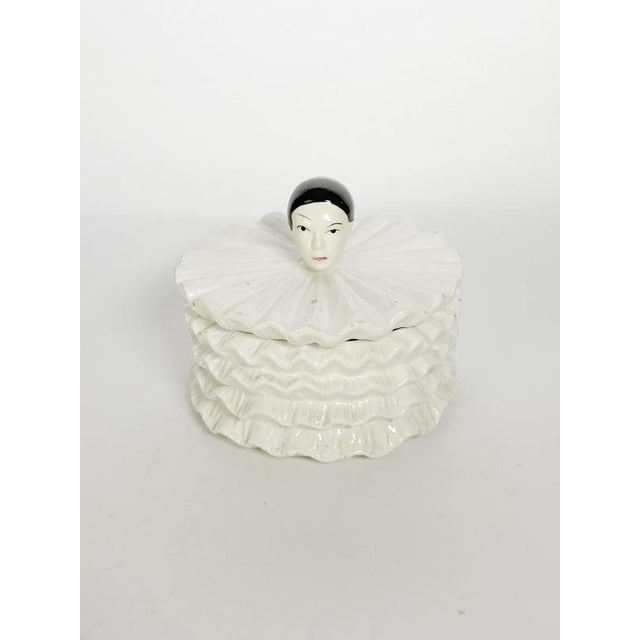 Charming French ceramic lidded box inspired by the iconic figure of Pierrot, the melancholy character of the Commedia...