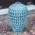 A vintage rattan floor vase with a gorgeous woven detailto the fibers and a great size. Enameled in a sky blue color...