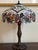 Offering a beautiful late-20th/early-21st century Tiffany-style stained glass table lamp. This gorgeous lamp features a...