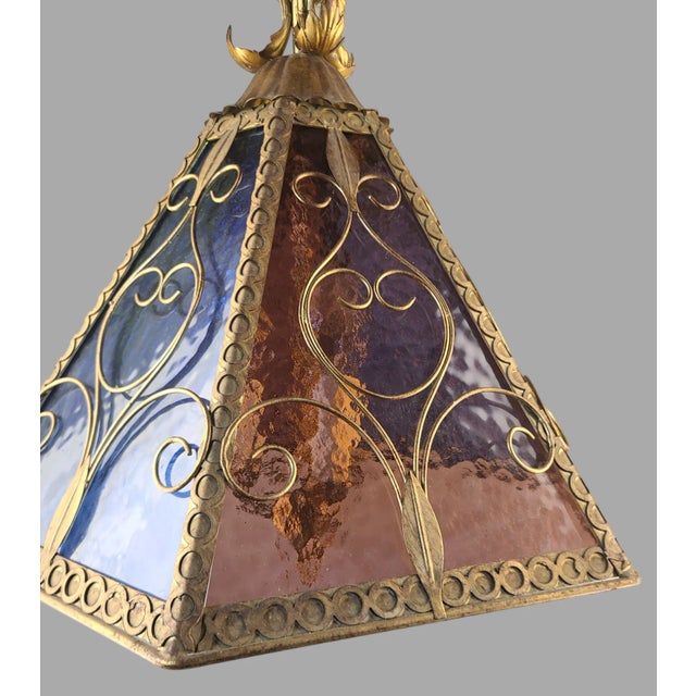 We are pleased to be offering this gorgeous gilded tole fixture with six multi color slag glass panels (Blue, Yellow,...