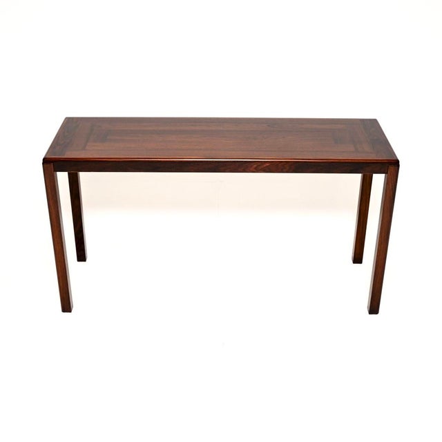 A smart and extremely well made Danish vintage console table. This was made in Denmark by Vejle Stole Mobelfabrik, it...