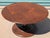 A striking Mid-Century Modern solid walnut coffee table featuring an exceptionally sculptural pedestal base and...