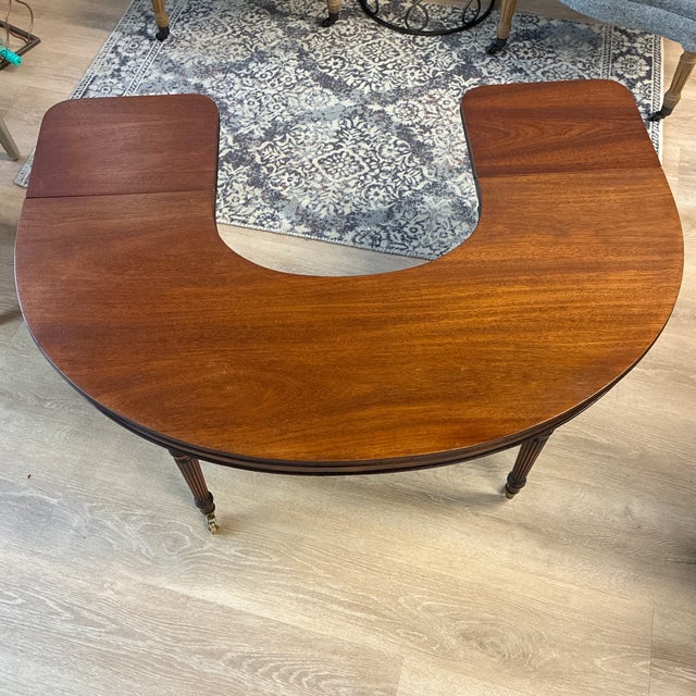 Half moon shaped coffee table that has two drop leaf ends. Originally called a “social” or wine tasting table. Great...