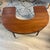 Half moon shaped coffee table that has two drop leaf ends. Originally called a “social” or wine tasting table. Great...