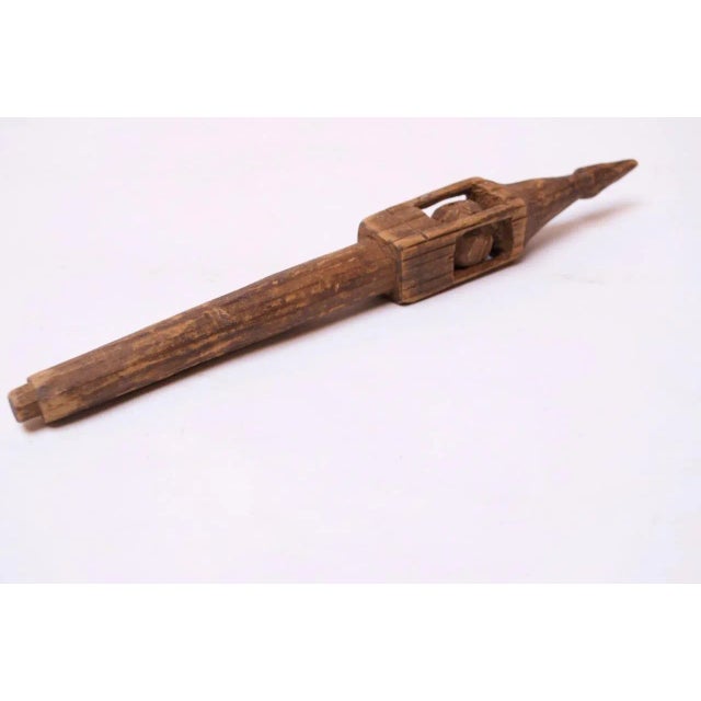 American whimsy with traditional 'ball in cage' decoration, all carved and whittled from one continuous piece of wood,...