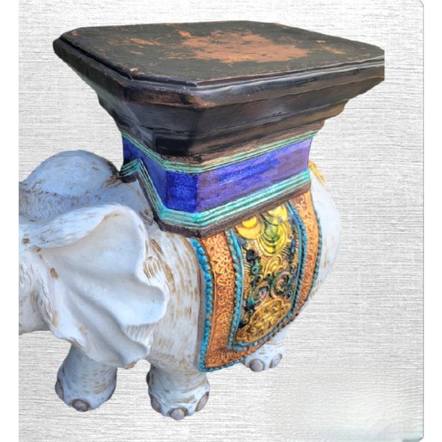 A wonderful extremely heavy Italian made terra cotta Regency garden stool. The elephant has the sweetest face with his...