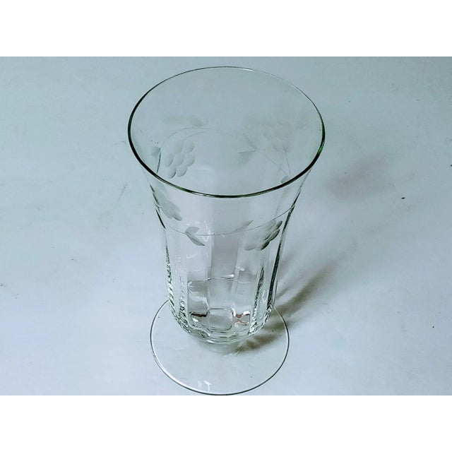 Very nice clear glass iced tea glass made in the 1940s by Libbey. It has optic panels and frosted etched flowers on a...