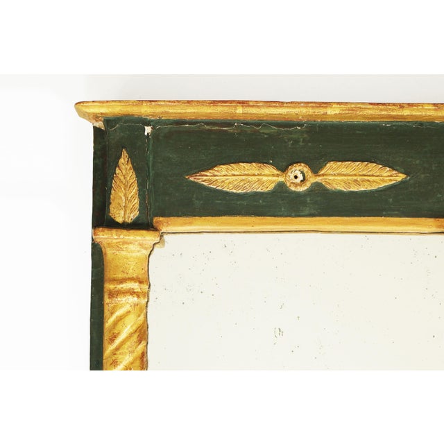 Elegant 19th century rectangular mirror crafted in the French Empire taste, featuring a striking combination of deep green...