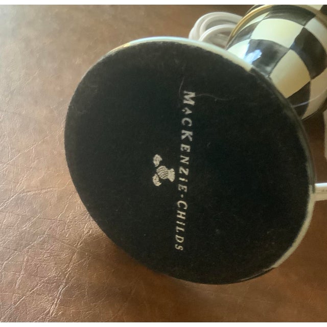 Classic signature black and white check with subtle brass accents; metal Mackenzie Childs tag attached to harp base;...