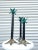 A set of 3 graduating palm tree candle stick holders. The bases are brass, and the leaves are a verdigris patina. These...