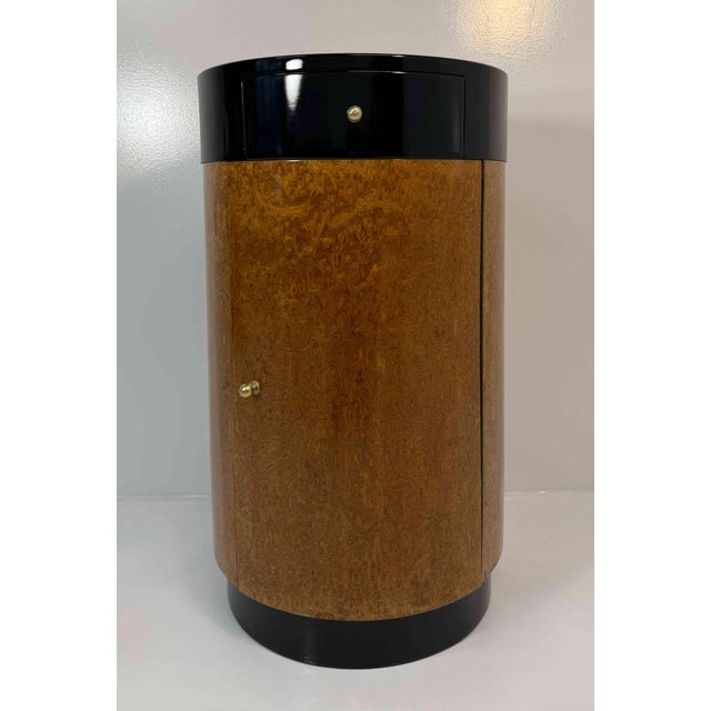 A striking Italian cylindrical cabinet dating from around 1980s, distinguished by its sculptural form and richly patterned...