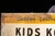 Vintage Painted Tin Tex Tan Western Wear Sign For Sale - Image 9 of 9