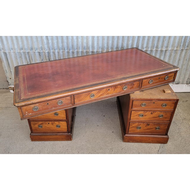 Warm glow to finish with old world charm to this mid 19th century Georgian desk. Tooled leather top, solid mahogany drawer...