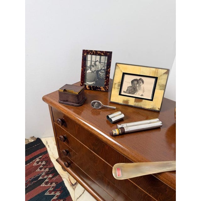 Distinctive vintage smoking accessory that conceals, within a classic gold-toned aluminum box covered in brown leather, a...