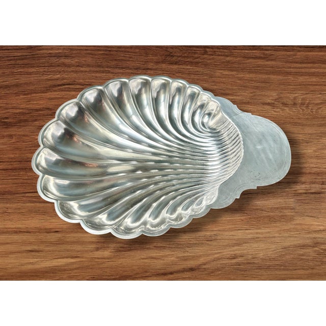 Large, deep, silver-plated scallop-shaped platter by Fleuron France, Christofle silversmith workshop. Marked on the...