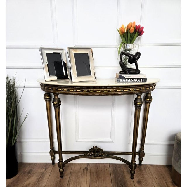 Very elegant and refined Italian 1950s Mid-Century Modern and neoclassical design console table. Characterized by the...