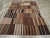 This Mid-20th century Turkish Flatweave Kilim rug, measuring 8' 6" x 12' 11", showcases a captivating patchwork design...