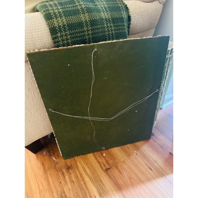 This is a handcrafted wall mirror adorned with a richly textured frame entirely encrusted in an assortment of natural...