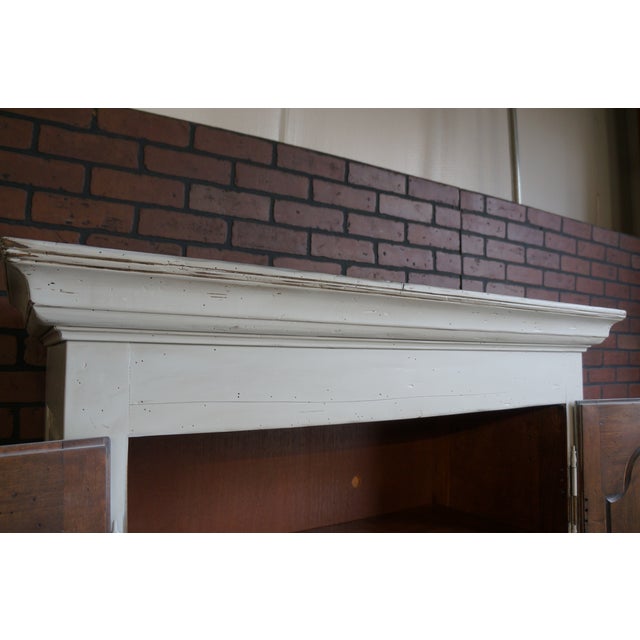 Charming vintage armoire hand painted, glazed and distressed adding a shabby chic flair. Interior features 4 adjustable...