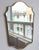 Mid-Century Italian wall mirror with brass frame (circa 1960s). This mirror is simply elegant and characterful in a...
