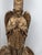A striking monumental Gothic Revival pedestal candleholder featuring a beautifully modeled praying angel standing above a...