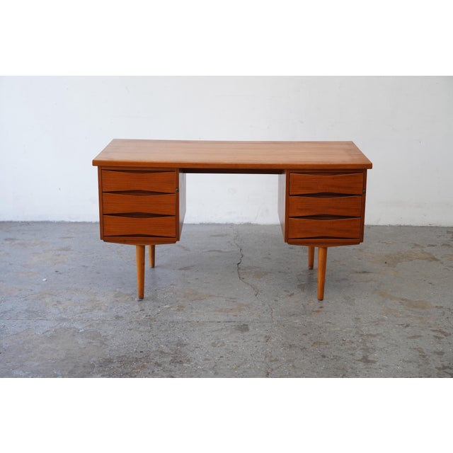 Mid-century Norwegian teak desk manufactured by Fredrik Kayser For Skeie & Co. Møbelfabrikk of Norheimsund, Norway. The...