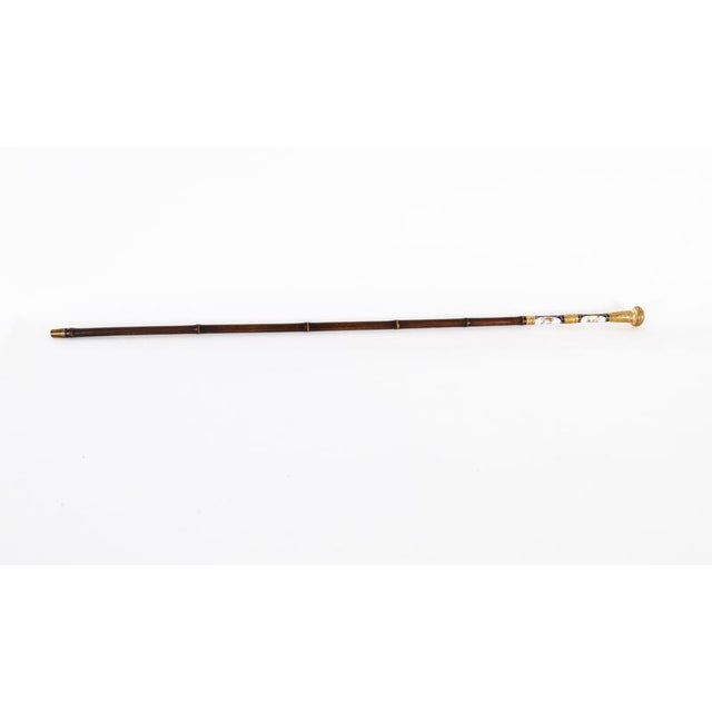 This is a fine antique French gold plate and Sevres porcelain handled walking cane / sword stick, circa 1880 in date. The...