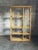 A gorgeous room divider or étagère composed of bamboo, rattan, and cane shelves. Features 4 shelf heights and two columns...