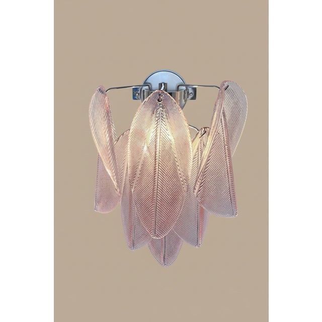 DUTIES FREE A refined expression of Italian craftsmanship, this pair of Murano wall lights features delicate pink...
