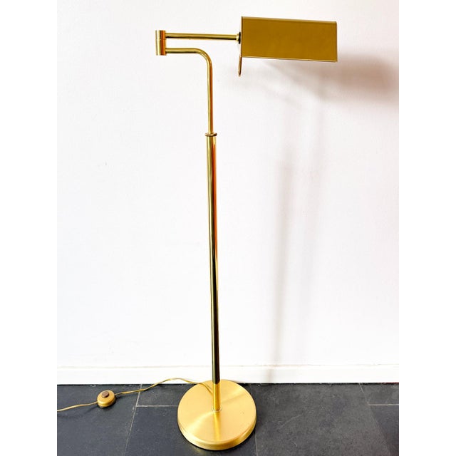 Vintage brass floor lamp by dutch lighting manufacturer dijkstra lampen, featuring an adjustable height, articulated swing...