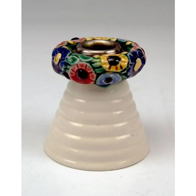 Elegant candlestick for holding one candle Modelled by Michael Powolny (1871-1954), circa 1907 Hallmarked: Manufactured by...