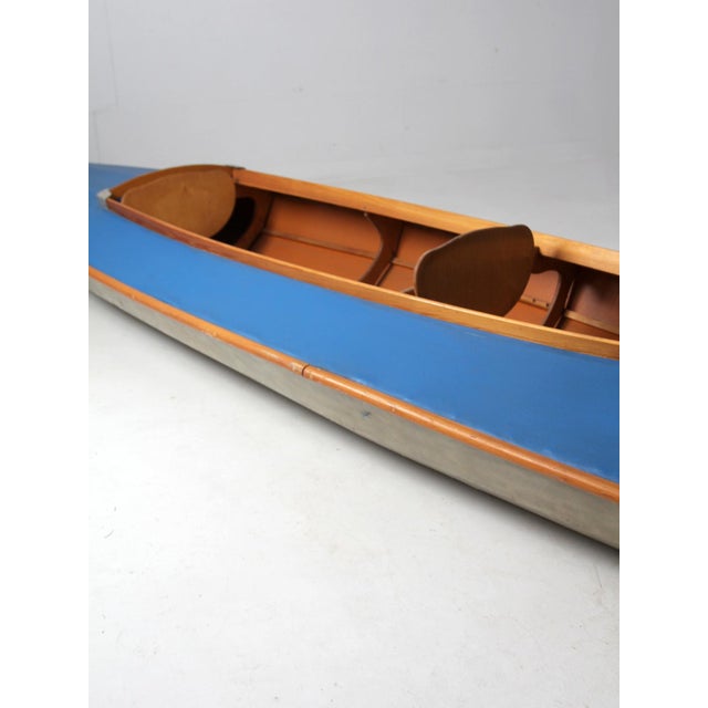 This is a 1970s vintage Folbot Super kayak. The 17.5 ft two seat kayak features a blue fabric top, gray base, and wood...
