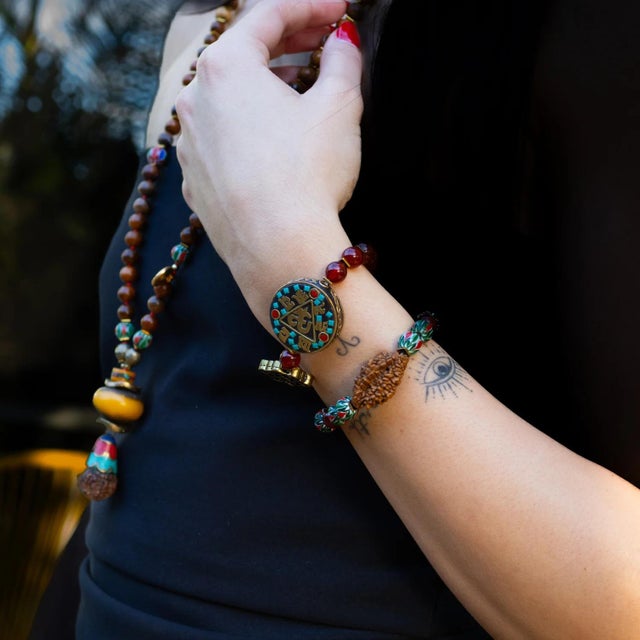 Mystic Root Rudraksha & Carnelian Spiral Bracelet Ground your energy and elevate your spirit with the Mystic Root...